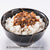 A black bowl with a crackled gold pattern is filled with white rice and topped with Taiwanese traditional dried meat. The plate is placed on a white surface. The text at the bottom indicates that the image is for reference only.